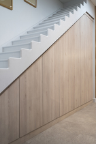 Light brown wooden understairs storage