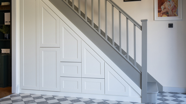 White understairs shaker storage